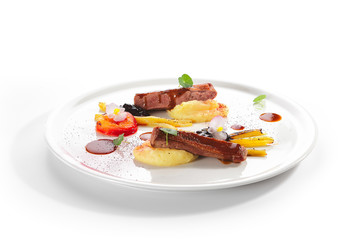 Fried Duck Breast with Baked Plum and Glazed Rhubarb Isolated