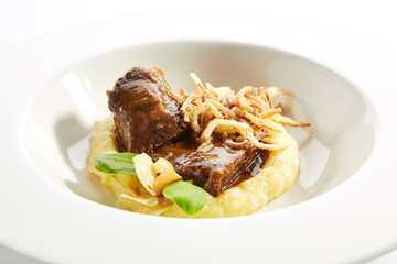 Beef Cheeks with Mashed Potatoes, Greens and Onion Fries