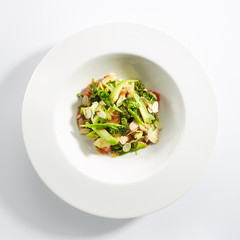 Salad with Avocado, Broccoli, Cucumber and Almonds Isolated