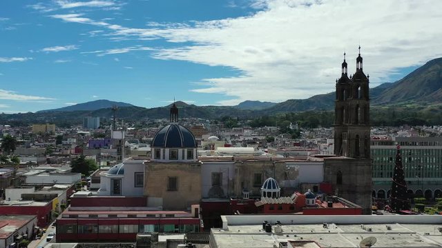 Tepic Cathedral Neo-Gothic catholic temple in city centre of Tepic, Nayarit in Mexico. Aerial drone view of Tepic and San Juan mountain.