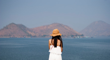 Traveler woman joy relaxing and look amazed nature landscape island, Tourism destination Asia, Girl on holiday vacation trip.