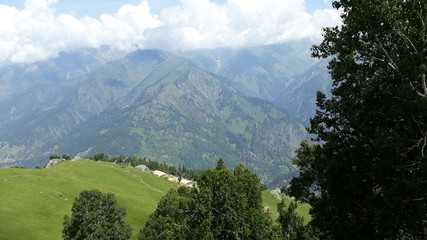 Dramatic seen of Clouds and lush green valley on Himalaya Peaks in Neelum Valley AJK