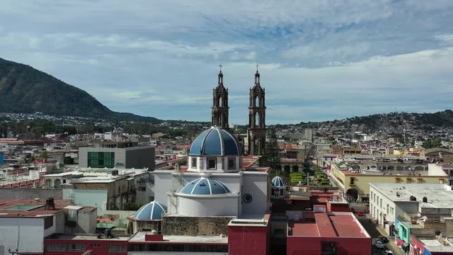 Tepic Cathedral in city centre of Tepic. State Nayarit in Mexico. Aerial drone view of Tepic and San Juan mountain.	