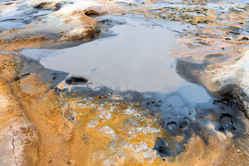 Colorful and textured volcanic ground in geothermal area in Icelandic landscape scenery. Mud and...