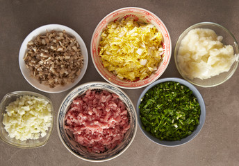Dumpling meat and vegetable ingredient in bowls 