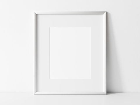 Vertical white frame mockup. White frame on white table mock up. 3d illustrations.