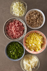 Dumpling meat and vegetable ingredient in bowls 
