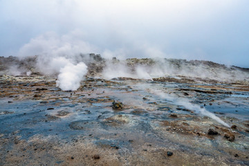 Hot sulfuric steam vent spewing sulphur steam in the hot sulfuric and geothermal area of Namaskard...