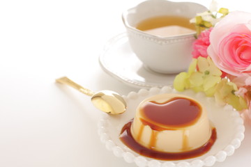 Caramel and baked pudding on white dish