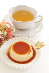Caramel and baked pudding on white dish