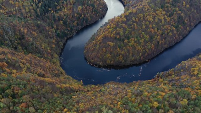 Beautiful Vyhlidka Maj, Lookout Maj, near Teletin, Czech Republic. Meander of the river Vltava surrounded by colorful autumn forest viewed from above. Tourist attraction in Czech landscape. Czechia.