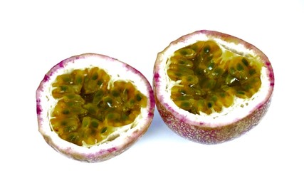 ripe organic half cut passion fruit isolated on white background. top view