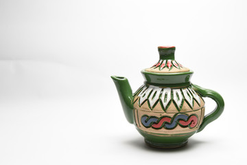 Eastern Porcelain teapot with Arabic patterns isolated over white