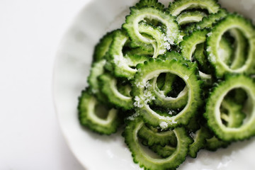Chinese cooking, salted bitter melon on dish with copy space