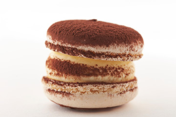 Cocoa powder macaroon on white background 