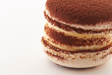 Cocoa powder macaroon on white background 