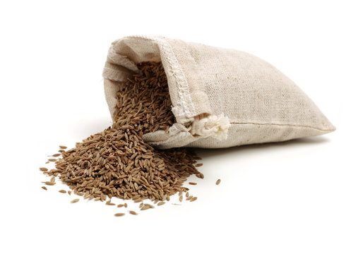 cumin seeds on white background