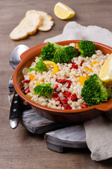 Warm pearl salad with vegetables