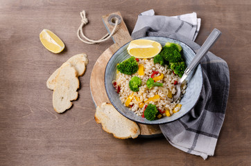 Warm pearl salad with vegetables