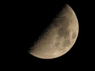 Naklejka premium First quarter moon, photographed in San Diego.