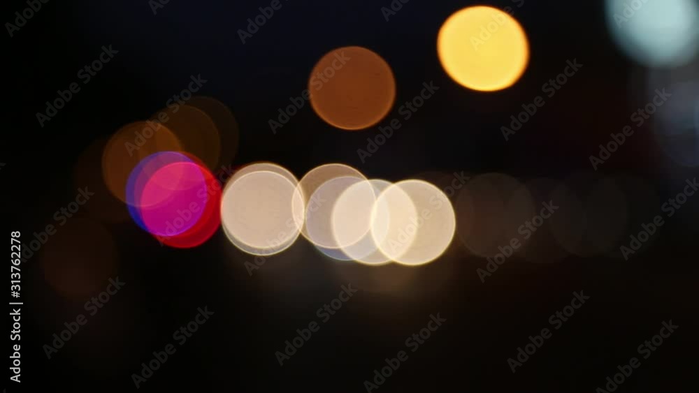 Wall mural blurred bokeh traffic on the road at night in a big city.