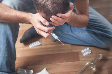 Drug addict man with a syringe. Addiction, Death