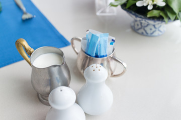 Silver small jar is contained milk for coffee