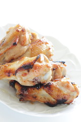 Asian chicken drumsticks barbecue on white dish
