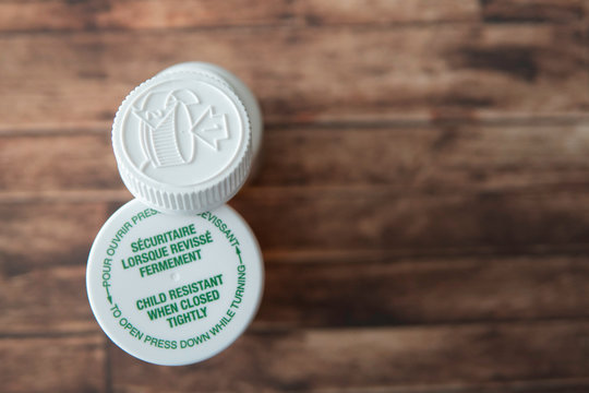 Child proof cover on prescription medicine bottles