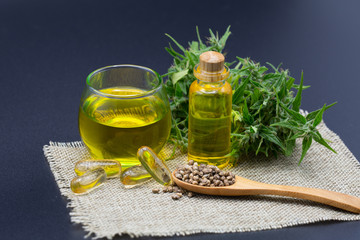 CBD oil hemp products  in a glass jar and hemp seeds.