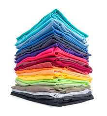 Stack of colorful t-shirt isolated on white background. File contains a path to isolation.