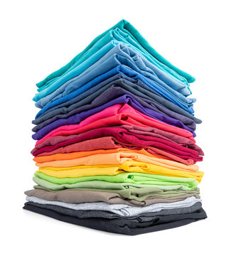 Stack of colorful t-shirt isolated on white background. File contains a path to isolation.
