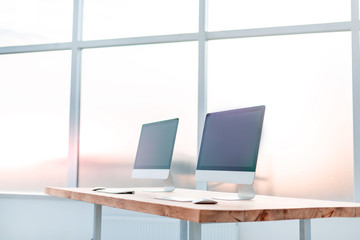 close up. modern computers on a wooden table