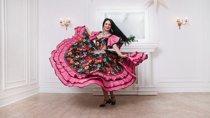 performer of Gypsy dance in a luxurious folk dress