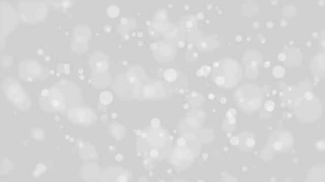 Animated glowing silver grey bokeh background with white flickering light particles.