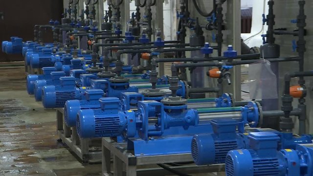 The engine room at the treatment facilities .Equipment inside the industrial premises . Effective water treatment concept.