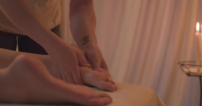 Young woman relaxing during body massage , 4k UHD