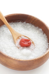 Japanese  food, Umeboshi and healthy rice congee in wooden bowl