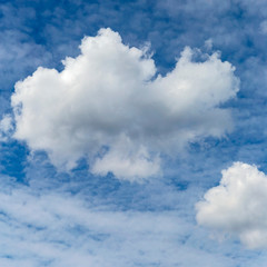blue sky with a large white cumulus cloud as a natural background