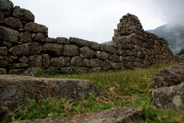 UNESCO World Heritage Site Machu Picchu on top of a Mountain Ridge above the Sacred Valley within the Rainforest in the Andes Mountain Range in Peru