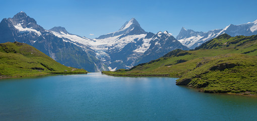 Naklejka na ściany i meble beautiful alpine panorama, lake Bachalpsee and swiss mountains, bernese oberland