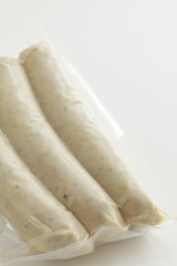 Packed food, pork and spice sausage on white background with copy space