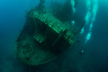 Scuba divers in wreck. Scuba diving in caribbean sea