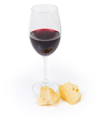 Red wine and two small broken pieces of hard cheese