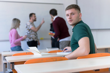 Group of  young multietchnic economy students analyzing company annual financial report balance and prepairing for test. Concept picture of economy, education.