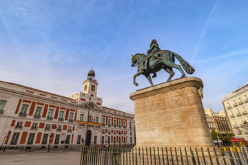 Madrid Spain, city skyline at Puerta del Sol and Clock Tower of Sun Gate with Equestrian Statue of Carlos III