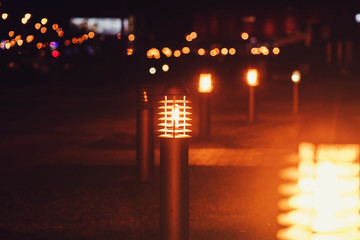 decorative small garden lamp illuminates the street
