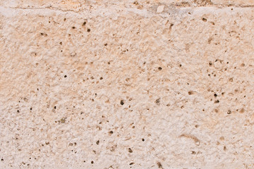 Background texture of the old fortress stone wall. Conceptual background for designers. Selective focus.