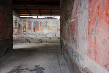 Colorful frescos in an upper class residential building in the ancient city of Pompeii, near Naples, Italy
