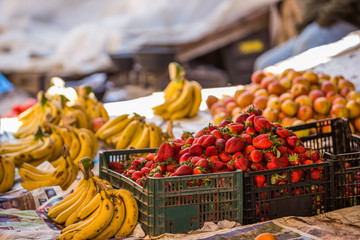 Strawberries and bananas sold on a moroccan market in the Medina of Fes